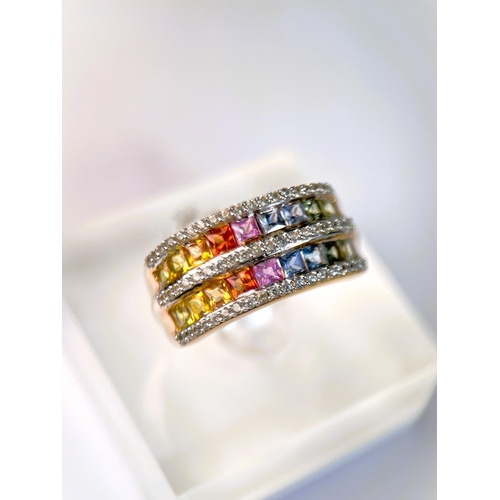 625 - A 9 carat hallmarked dress ring with 3 bands of clear stones and 2 bands of rainbow coloured stones,... 