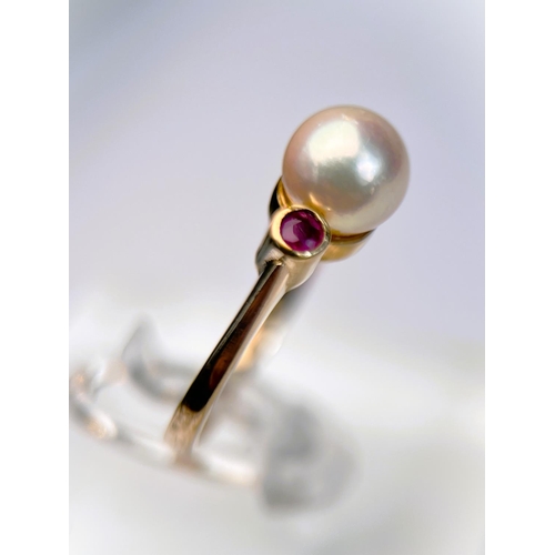 626 - A 9ct gold ring set with a central pearl flanked by 2 small rubies, 3.3gm size N: a 9ct gypsy style ... 