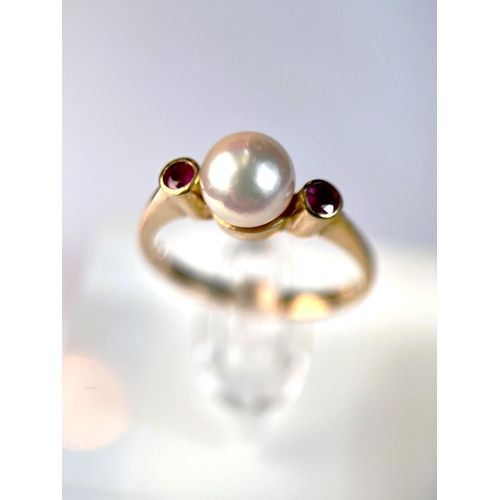 626 - A 9ct gold ring set with a central pearl flanked by 2 small rubies, 3.3gm size N: a 9ct gypsy style ... 