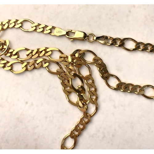 629 - A yellow metal flattened curb and oval link chain stamped 375, 23.5gm