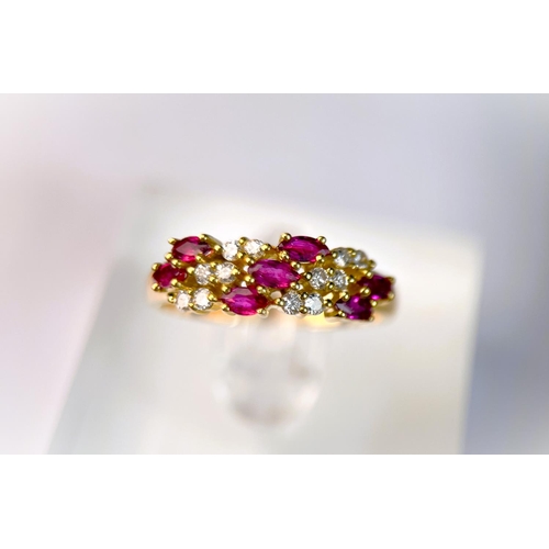 631 - A yellow metal dress ring set with diagonal bands of rubies and diamonds (markes rubbed) 3.9gm, size... 