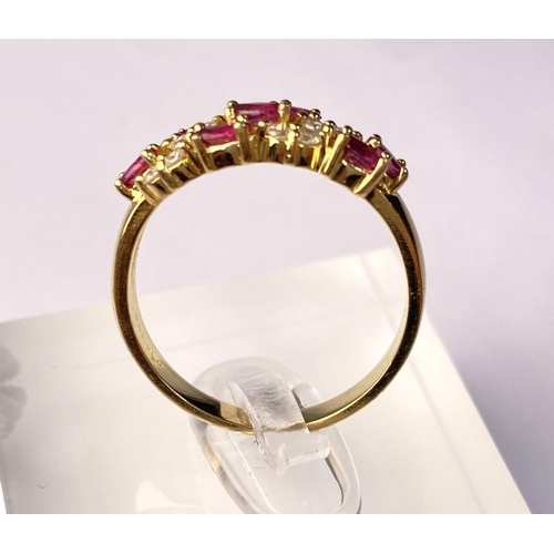 631 - A yellow metal dress ring set with diagonal bands of rubies and diamonds (markes rubbed) 3.9gm, size... 