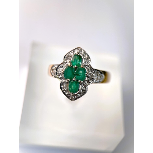 632 - A 9 carat hallmarked gold dress ring of shaped oval form set with 4 green stones, 3.7gm, size 0, a 9... 