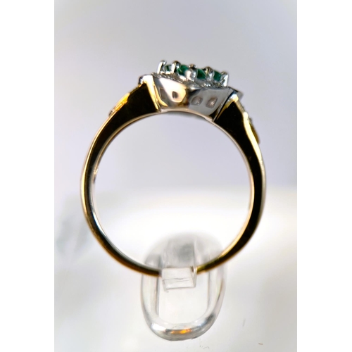 632 - A 9 carat hallmarked gold dress ring of shaped oval form set with 4 green stones, 3.7gm, size 0, a 9... 