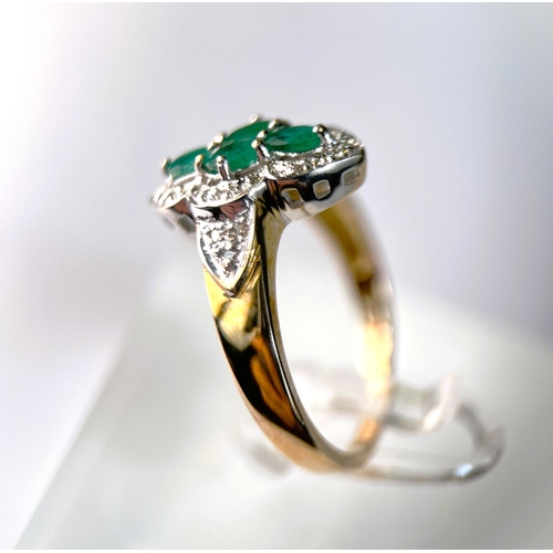 632 - A 9 carat hallmarked gold dress ring of shaped oval form set with 4 green stones, 3.7gm, size 0, a 9... 