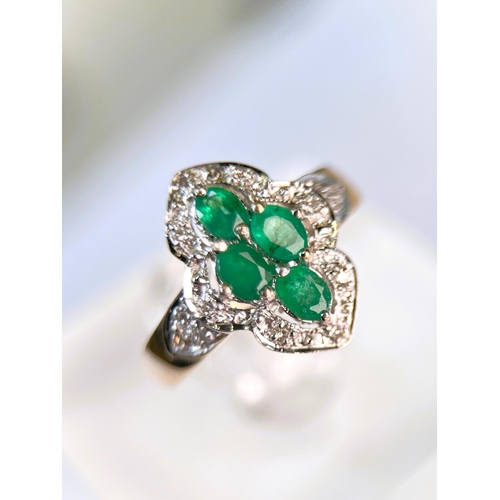 632 - A 9 carat hallmarked gold dress ring of shaped oval form set with 4 green stones, 3.7gm, size 0, a 9... 