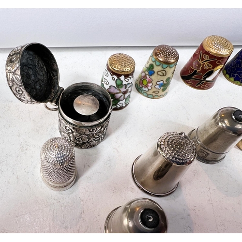 645 - A selection of thimbles - cloisonnee, enamels etc, including embossed white metal thimble case stamp... 