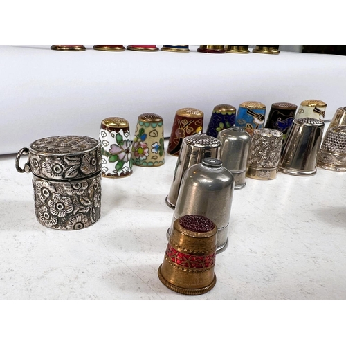 645 - A selection of thimbles - cloisonnee, enamels etc, including embossed white metal thimble case stamp... 