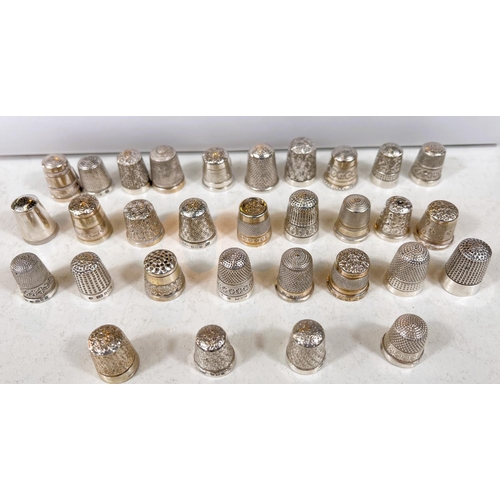 646 - A selection of hallmarked silver thimbles, various dates and assay offices, 7oz.