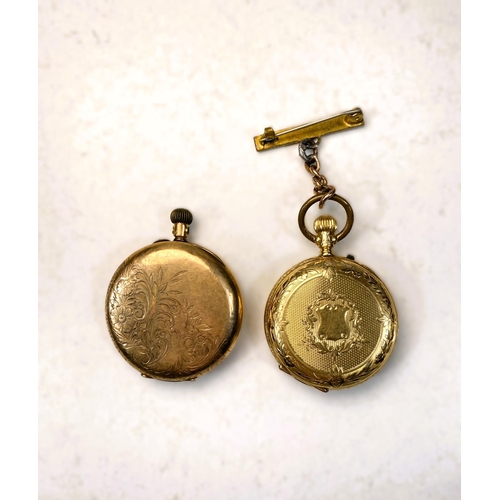 657 - A chased yellow metal open faced keyless fob watch, the outer back case stamped 14K (a.f); a similar... 