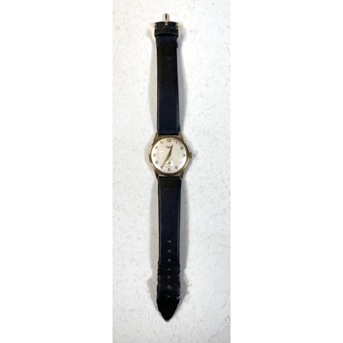 666 - A Longines gents gold watch with champagne dial and Roman numerals on black leather strap (inscribed... 