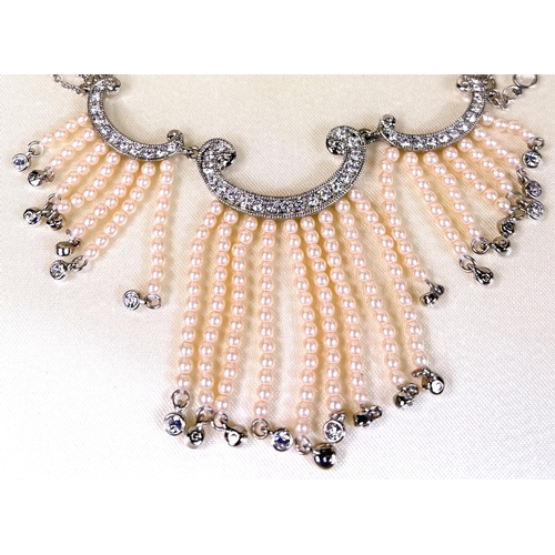 681 - A diamante and faux seed pearl necklace on triple chain with matching earrings, boxed