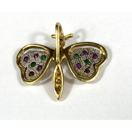 688 - An 18ct gold pendant in the form of a butterfly set with multicoloured stones