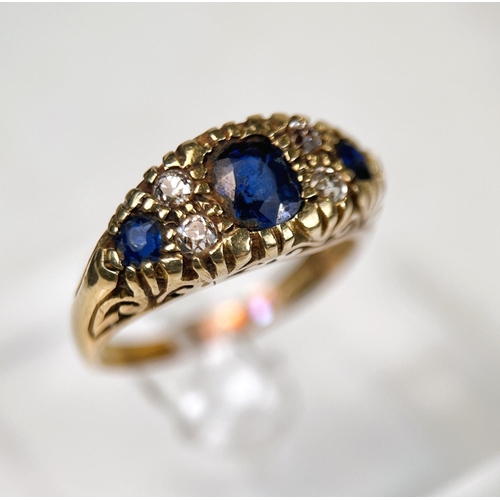 720 - A Victorian style 18ct hallmarked gold sapphire and diamond ring, length of central stone, approx 6m... 