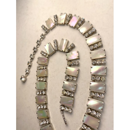 728 - A mid 20th century cocktail necklace formed from rectangular pieces of mother of pearl, each intersp... 