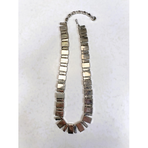 728 - A mid 20th century cocktail necklace formed from rectangular pieces of mother of pearl, each intersp... 