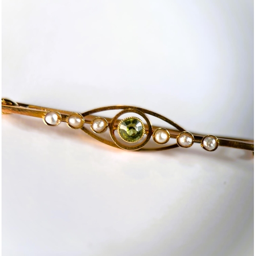 774 - Peridot pearl bar brooch stamped 15, 2.6gm; pair of matching earrings (unmarked) 