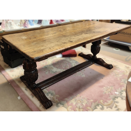 931 - A large Elizabethan style refectory dining table with thick plank top and carved bulbous legs, lengt... 