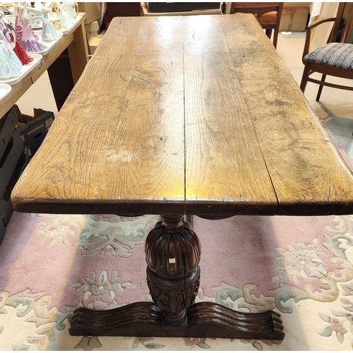 931 - A large Elizabethan style refectory dining table with thick plank top and carved bulbous legs, lengt... 