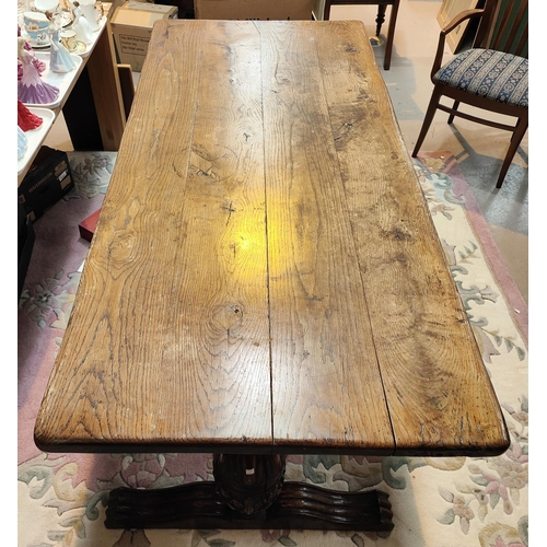 931 - A large Elizabethan style refectory dining table with thick plank top and carved bulbous legs, lengt... 