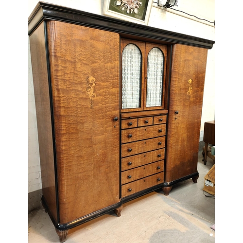 984 - A large early 20th century continental stained walnut reverse breakfront triple wardrobe with eboniz... 