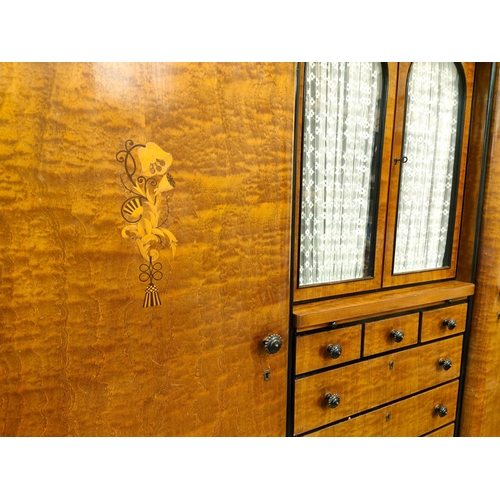 984 - A large early 20th century continental stained walnut reverse breakfront triple wardrobe with eboniz... 