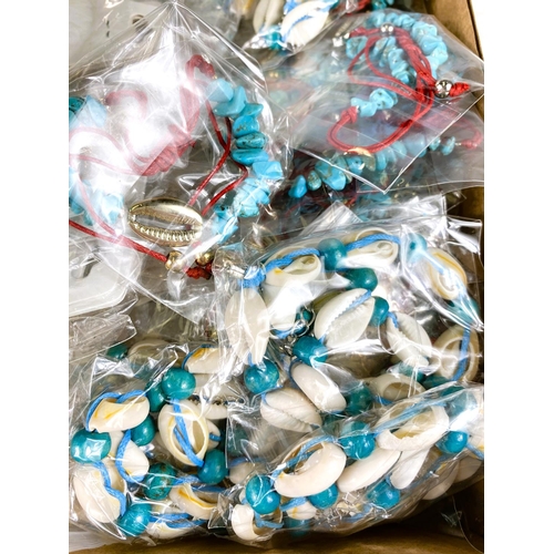 664 - A large quantity of shell, turquoise and coloured bracelets and necklaces, gilt necklaces etc