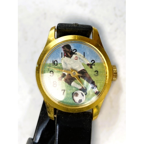 738 - A novelty Pele vintage wristwatch