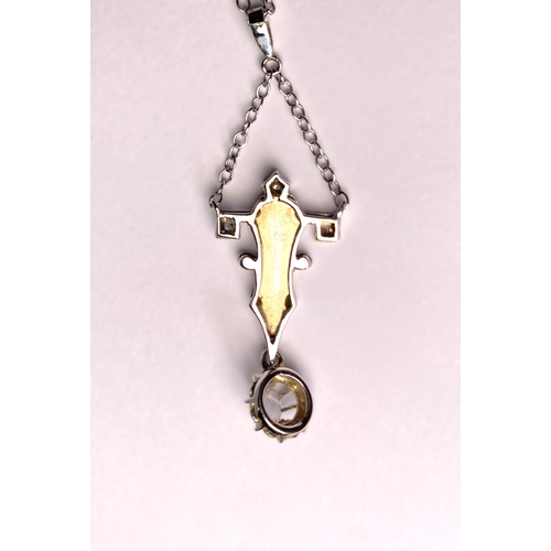 757 - An Art Deco cruciform style white metal pendant with diamond drop, tests as 9ct, on fine chain stamp... 