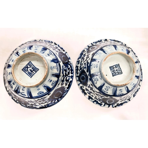 400 - Two Chinese bowls blue and white decoration with seal marks to base (chips to rim)