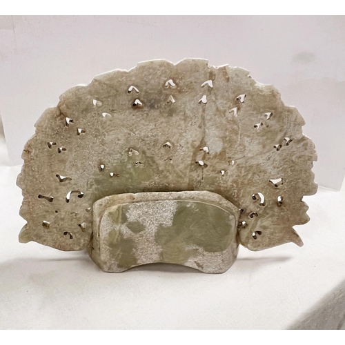 402 - An unusual South American stone headdress with bird with fanned tail  