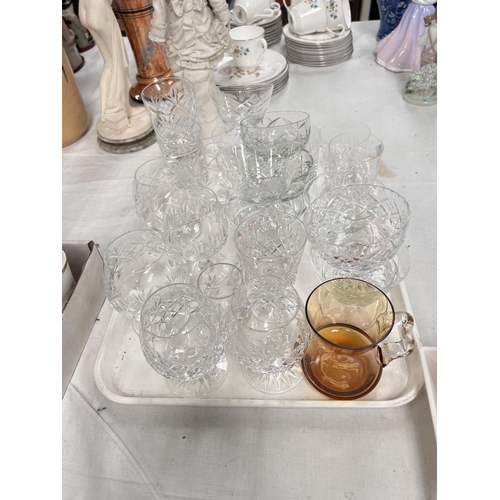 580 - 2 decanters and a large selection of cut drinking glasses