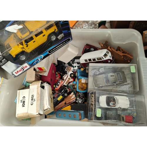 129 - A collection of boxed and loose diecast vehicles including James Bond models