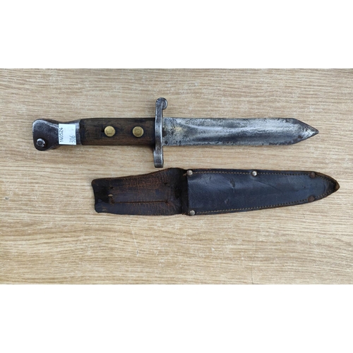 306 - A late 19th / early 20th century field bayonet knife, broad arrow marks and a similar German bayonet... 