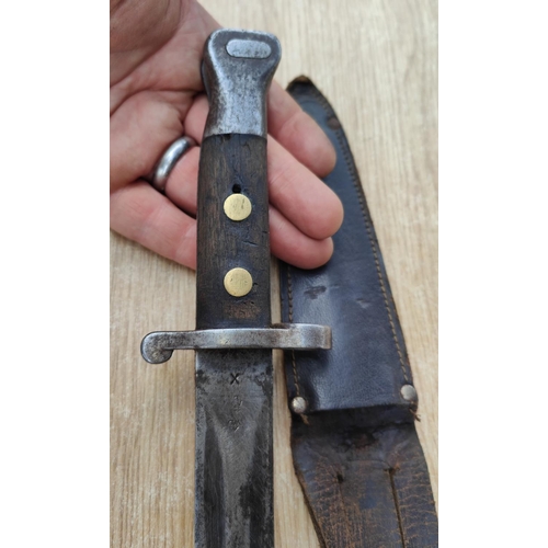 306 - A late 19th / early 20th century field bayonet knife, broad arrow marks and a similar German bayonet... 