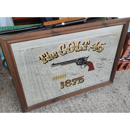 309A - A large reproduction Colt 45 advertising mirror, 55 x 80cm