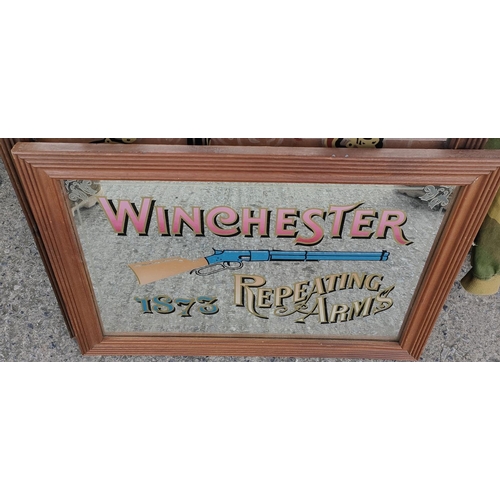 309B - A reproduction Winchester Repeating Rifle advertising mirror, 37 x 55cm