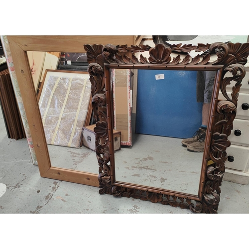 59 - A 19th century rectangular wall mirror in carved frame; a pine framed wall mirror