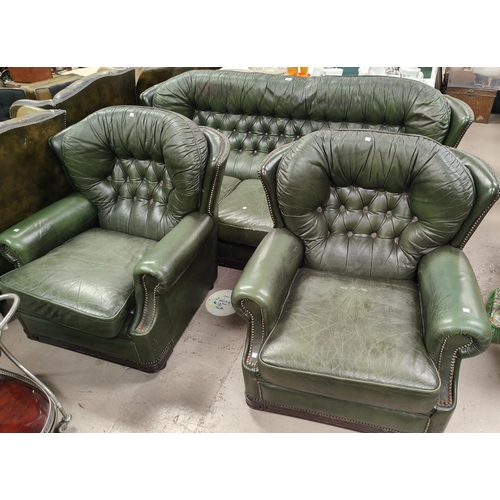 874 - A pair of green leather effect Chesterfield style armchairs and a matching 3 seater leather style se... 