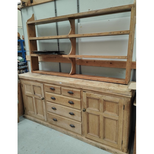 933 - A large Victorian pine Welsh dresser with enclosed cupboard with 5 drawers and matched delft rack to... 