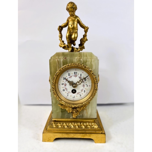 121 - A 19th century French Ormolu mantel clock with gilt cherub decoration