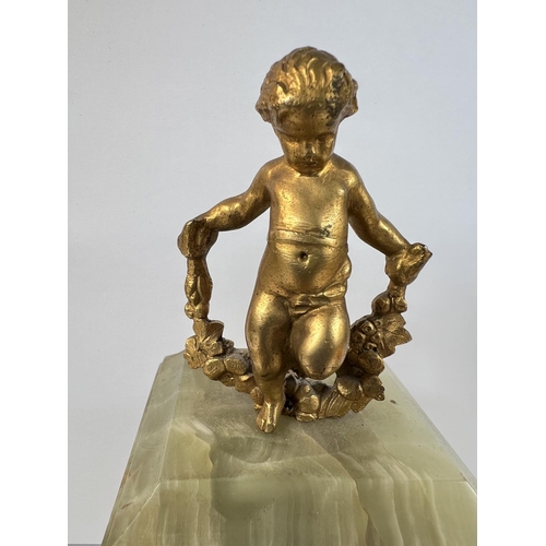 121 - A 19th century French Ormolu mantel clock with gilt cherub decoration