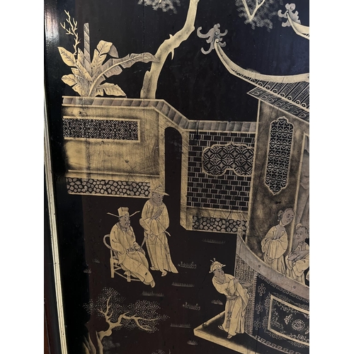 421 - A mid 20the century Chinese lacquer panel with gilt decoration of a domestic scene