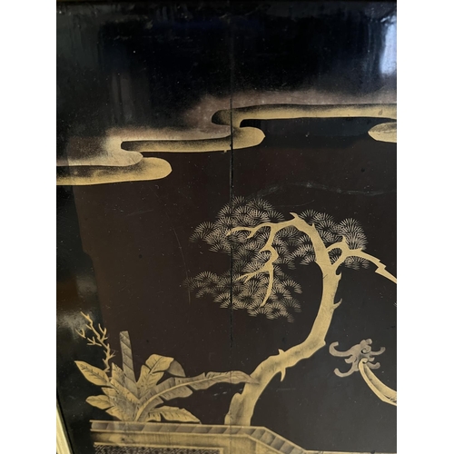 421 - A mid 20the century Chinese lacquer panel with gilt decoration of a domestic scene