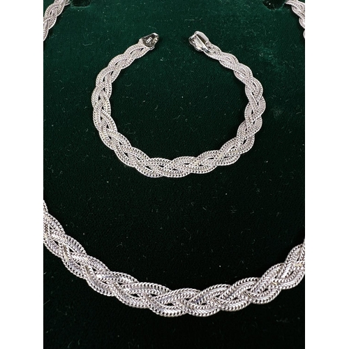 612 - A plaited white metal neck chain and bracelet stamped 375. 21gm