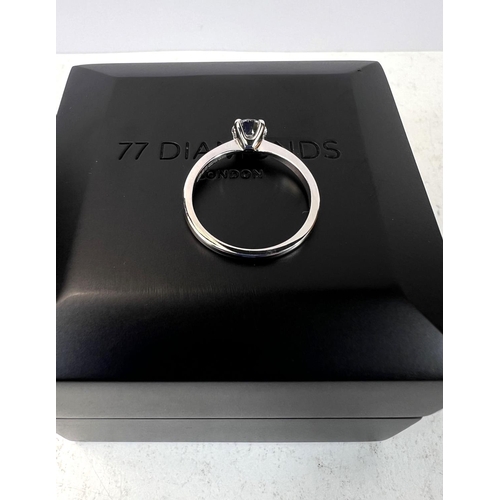 763 - An 18ct hallmarked white gold lady's solitaire diamond ring, size H/I, in double presentation box wi... 