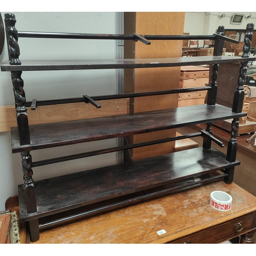 977 - A three tier ebonised mahogany open bookcase