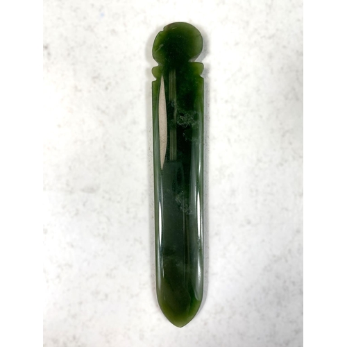 709 - A New Zeland Tiki nephrite jade pendant with carved face and a Chinese jade pendant 