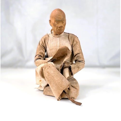 403 - A 19th century Indian Krishnagar figure of a seated man, with detailed face