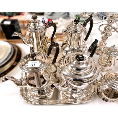 731 - Two 3 piece silver plated tea services; a square tray; a candelabra etc